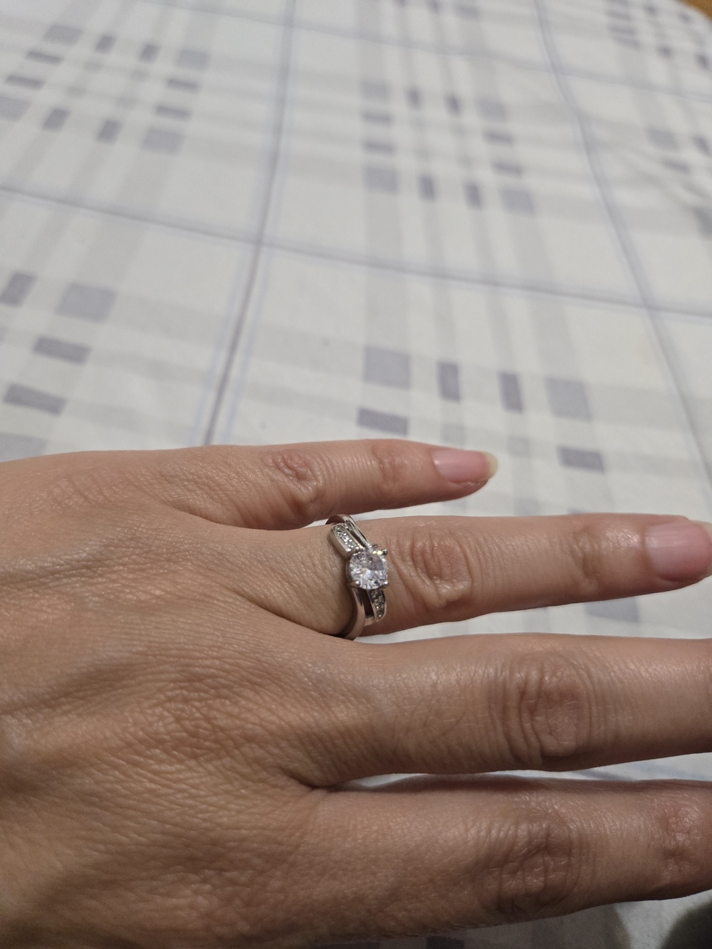 Elegant Silver-Tone Solitaire Engagement Ring with Clear Stone